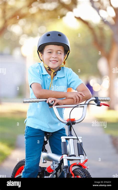 Boy Wearing Safety Helmet Riding Bike Stock Photo - Alamy