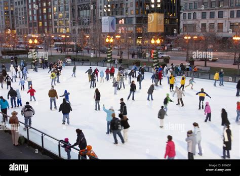 SKATING Chicago Illinois Ice skaters at Millennium Park ice rink winter ...