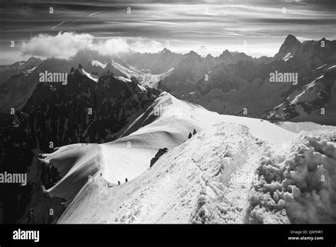 Ski climbers descending from the summit of Aiguille du Midi in Mont ...
