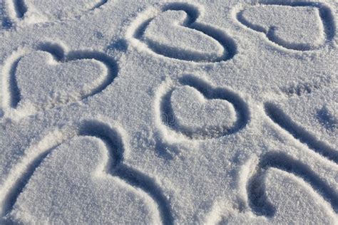 A Heart Symbol Drawn on Snow Stock Image - Image of romance, group: 235592259