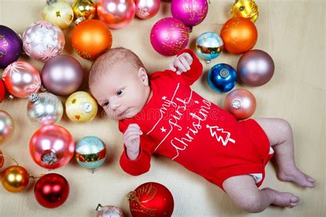 Newborn Baby with Christmas Tree Decoarations and Colorful Toys and ...