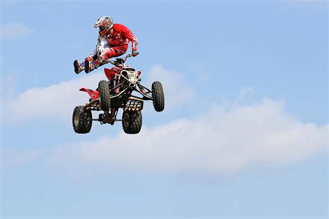 Quad Stunts- In The Air I Photograph by Debbie Oppermann - Fine Art America