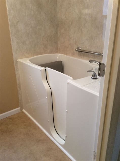 We installed a Boca walkin tub with a marble look acrylic surround. #bigbearremodeling | Walk in ...