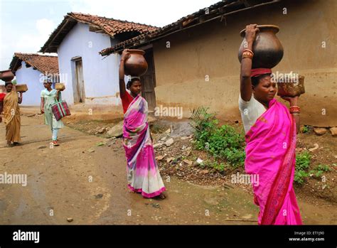 Women carrying pots, Ho tribe, tribal people, Chakradharpur, West Singhbhum, Jharkhand, India ...