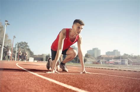 Athletes Running on Track and Field Oval in Grayscale Photography · Free Stock Photo