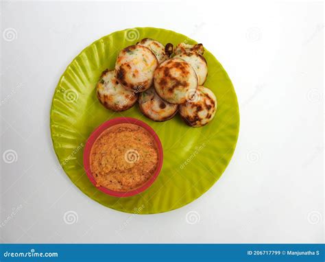 Paddu or Kuzhi Paniyaram and Coconut Chutney in a Green Plate Isolated on White Background ...