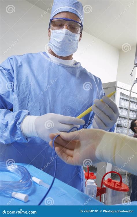 Surgeon in Operating Room stock image. Image of instrument - 29658101