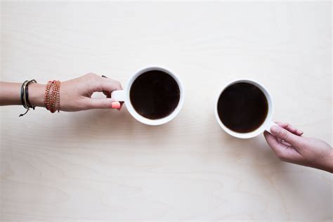 Two People Holding White Mugs · Free Stock Photo