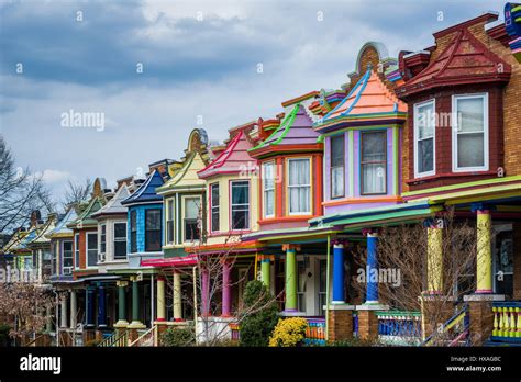 Colorful row houses along Guilford Avenue in Charles Village, Baltimore ...