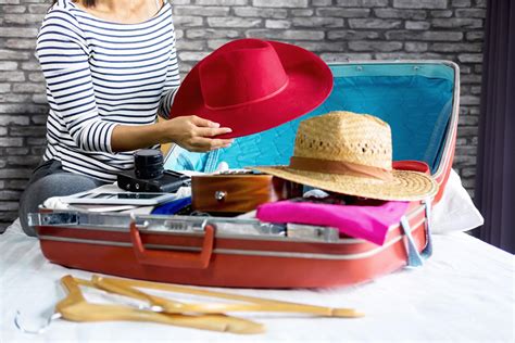 Young woman packing clothes for travel 1226644 Stock Photo at Vecteezy