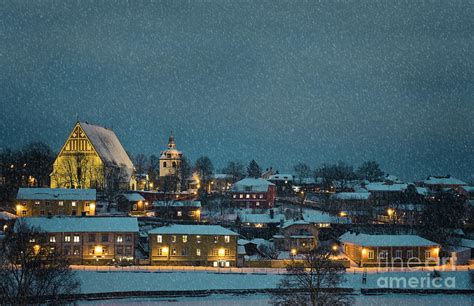 Small town winter landscape in the evening with snowfall Photograph by ...