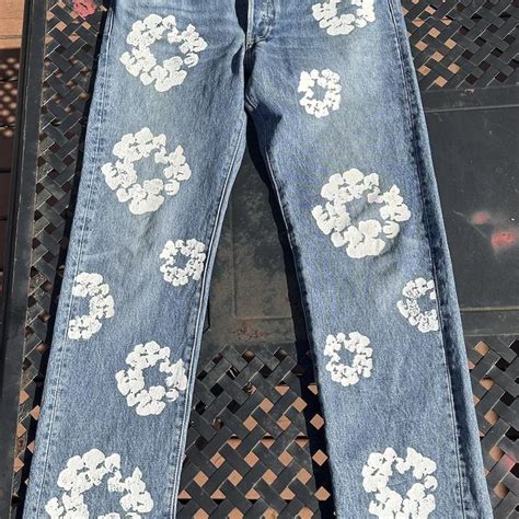 Denim tears Light blue wash jeans with floral... - Depop