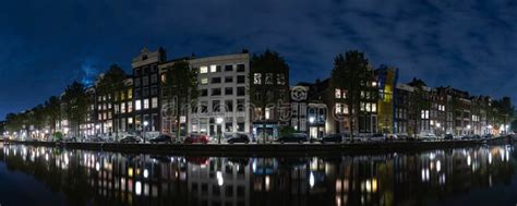 Amsterdam Canal at Night stock image. Image of facades - 260651533