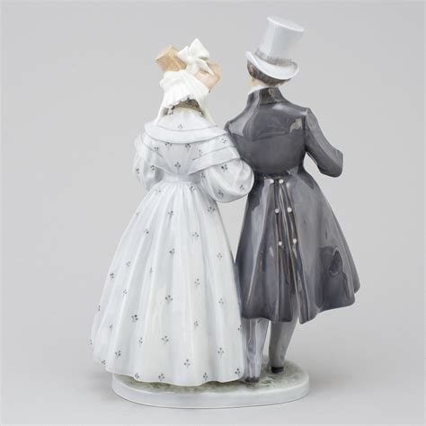 A Royal Copenhagen porcelain figurine, 'Victorian couples'. - Bukowskis