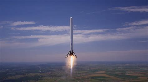 Watch SpaceX's reusable rocket hover at high altitude, scare some cows, and then land perfectly ...