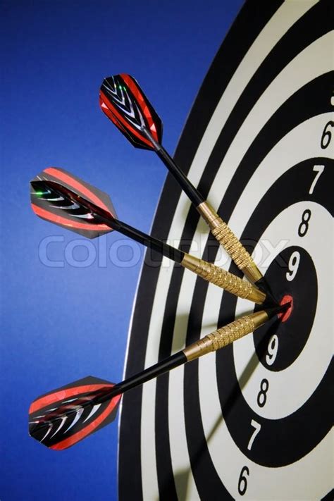 An arrow game with a dart has hit the ... | Stock image | Colourbox