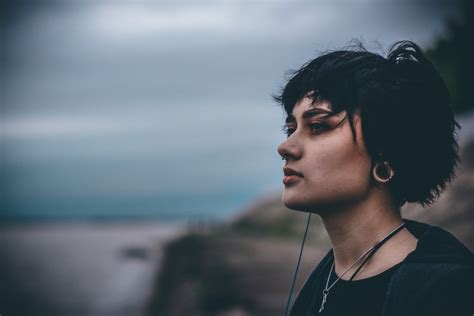 Woman Wearing Black Crew Neck Shirt Under White Clouds · Free Stock Photo