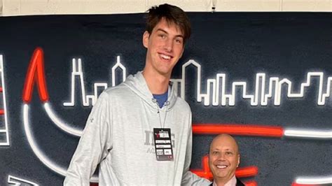 7'9" basketball player Olivier Rioux makes announcer look tiny in photo