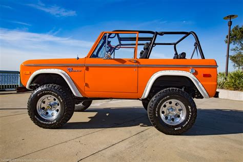 Orange Classic Ford Bronco with Coyote V8 engine and many other upgrades recently restored by ...