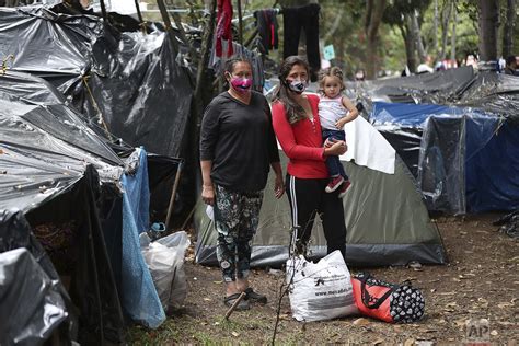 Venezuelan migrants make long trek back home — AP Photos