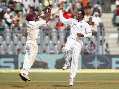 West Indies' Marlon Samuels banned from bowling by ICC for 12 months – Firstpost