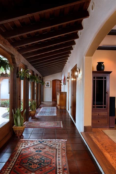 With rich wood accents and woven textures throughout, this Spanish ...