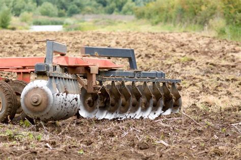 Farmer Using Tractor To Plough Field Stock Photo - Image of machinery, plants: 64352666