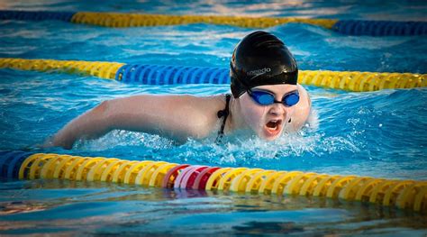 person, wearing, black, swim, cap, blue, goggles, swimming, butterfly ...