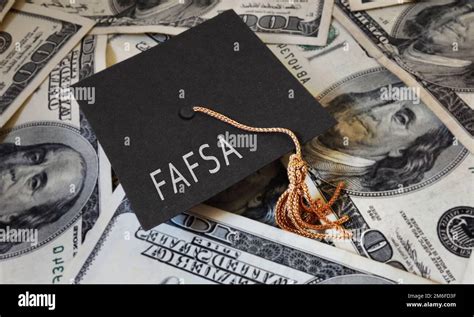 FAFSA (Free Application for Federal Student Aid) text on graduation cap ...