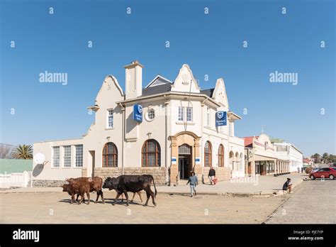 WINBURG, SOUTH AFRICA, JULY 30, 2018: A street scene with businesses, people and vehicles, in ...