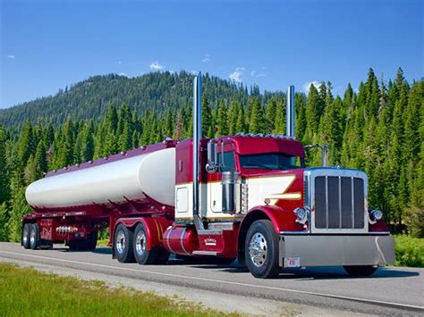 2012 Peterbilt 389 With Tanker Maroon And White 3/4 Front View On Road