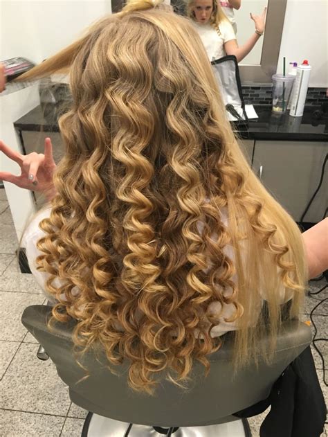 Super straight hair made curly with a tapered curling wand for a ...