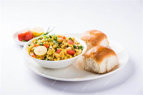 Premium Photo | Masala Anda Bhurji or Spicy Indian scrambled eggs with roasted bread or Bun or ...