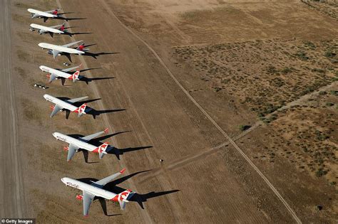 Hundreds of planes parked up in Arizona desert at a giant 'boneyard' airbase remain in storage ...