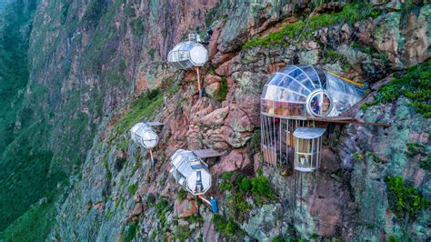 Incredible lodges literally hang off the side of a mountain in Peru - and tourists can actually ...