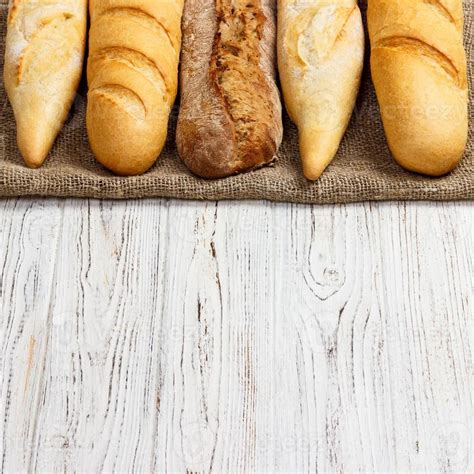 different types of baguette on a wooden background 14263190 Stock Photo ...