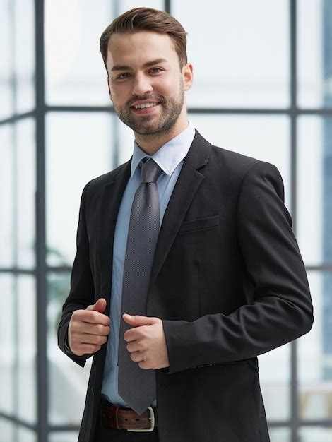 Premium Photo | Portrait of a happy man wearing glasses and looking at ...