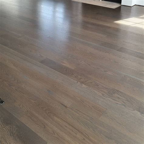 A very popular color in the industry for us, a water popped white oak floor stained classic gr ...