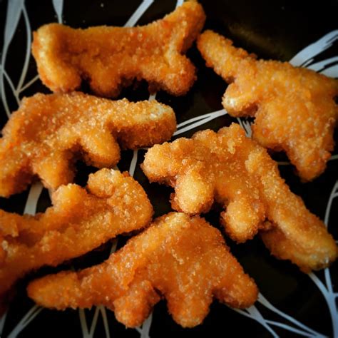 Eating dinosaur-shaped chicken nuggets for breakfast because I am an ...