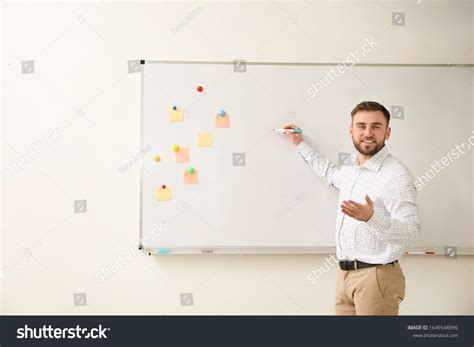 Portrait Young Teacher Writing On Whiteboard Stock Photo 1649548996 | Shutterstock