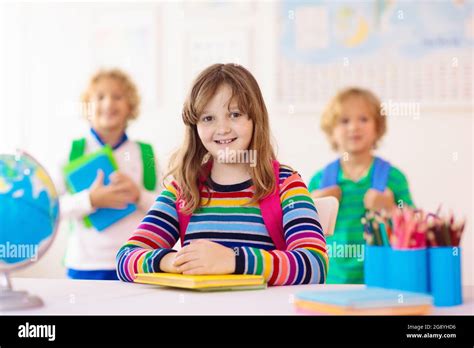 Kids in school. Preschool children in class. Happy kids back to school ...