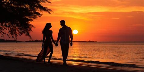 Premium AI Image | Silhouette of a romantic couple on the beach at sunset