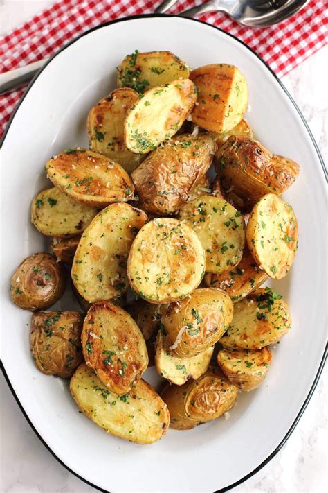 Roasted new potatoes with parmesan and fresh herbs. An easy side dish ...