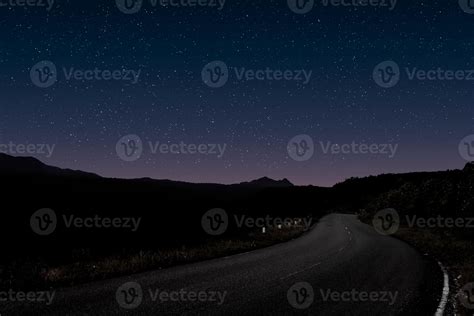 Mountain forest road night landscape 12736095 Stock Photo at Vecteezy