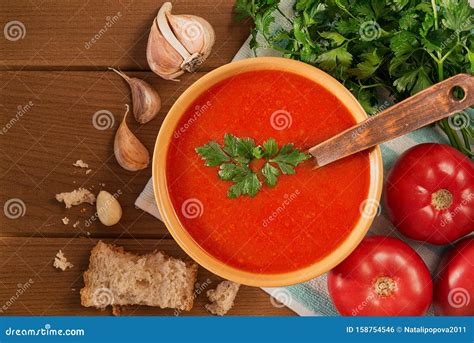 Tomato Soup with Garlic and Parsley on Wooden Table Closeup. Horizontal View from Above Stock ...