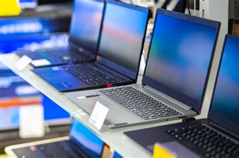 Premium Photo | A sample of laptops in a shop window behind glass on a ...