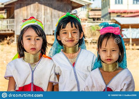 Three Young Padaung Girls in Traditional Dress and with Metal Rings on ...