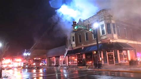 Fire rips through historic downtown Hobart building; Police officer injured in crash responding ...