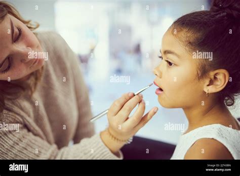 Keep calm and sparkle on. a stylist applying makeup to a cute little ...