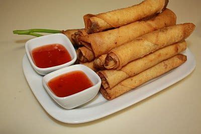 Yep, lumpia with some sweet & sour sauce. Be nice to have some lettuce ...